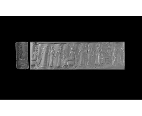 Ur III Period, 2112-2004 BC. A black limestone cylinder seal, a contemporary copy of an earlier seal, with frieze comprising 