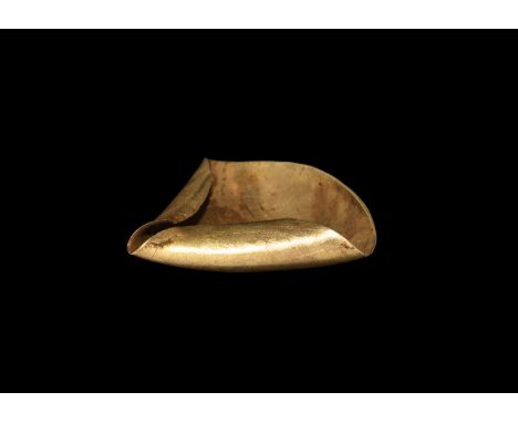 6th-4th century BC. A gold miniature oil lamp formed as a dished sheet gold disc folded to create a triangular reservoir.  3.
