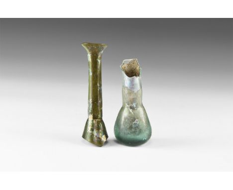 1st century AD. A mixed group of iridescent glass toilet bottle fragments comprising: one with flat-bottom bulb and part of m