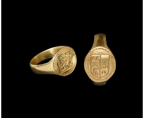 15th-16th century AD. A D-section gold hoop with discoid bezel, beaded border surrounding a heater shield with heraldic arms 