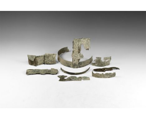 6th-7th century AD. A set of bronze fittings from a stave-built wooden bucket, decorated with repoussé pellets and incised li