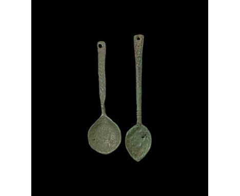10th-12th century AD. A group of two miniature bronze spoons comprising of: one with shallow leaf-shaped bowl and round-secti