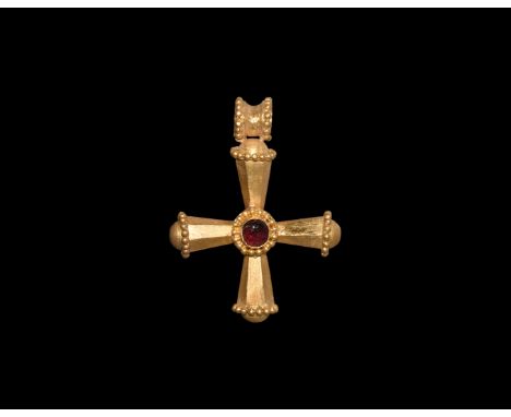 5th-7th century AD. A hollow-formed gold cruciform pendant formed as four hollow hexagonal-section expanding arms each with a