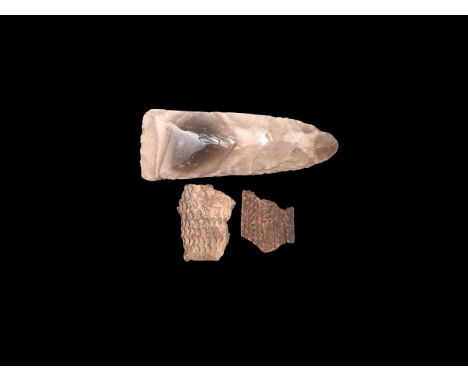 Neolithic, 8th-5th millennium BC. A mixed group comprising: a knapped and polished flint handaxe with rounded butt and square