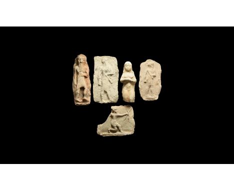 19th-17th century BC. A group of five ceramic plaques comprising of: two rectangular with a low-relief figure of a standing b