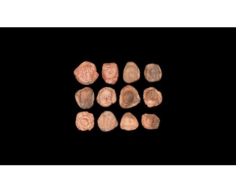 1st-3rd century AD. A mixed group of discoid ceramic theatre tokens or seals with impressed motifs from intaglio matrices, ma