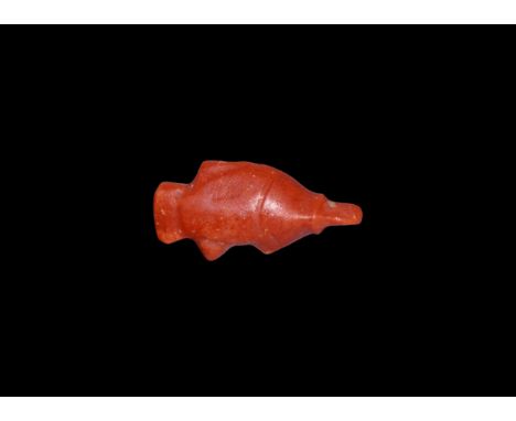 New Kingdom, 1550-1070 BC. A red jasper amulet of the tilapia fish, symbolic of regeneration. Cf. Andrews, C. Amulets of Anci