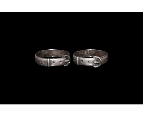 16th century AD. A silver flat-section hoop with detailing of buckle, tongue, holes and keeper. See Oman, C.C. British Rings 