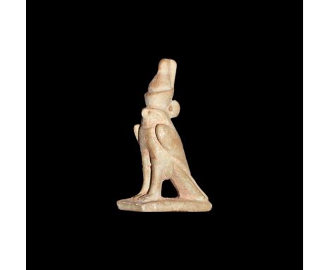 Third Intermediate Period, 1069-702 BC. A large pale olive glazed composition amulet of a sparrowhawk wearing the Double Crow