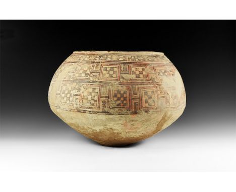 3rd-2nd millennium BC. A wide ceramic bowl with chamfered rim, panels of dense polychrome geometric ornament to the shoulder 