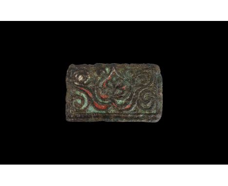 1st century BC. A rectangular box fitting of the Brigantes, possibly the end-panel of a wooden casket, with champ levé enamel