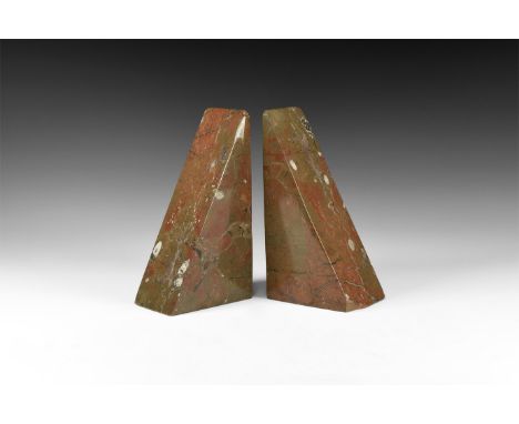 Jurassic Period, 201-66 million years BP. A pair of polished limestone triangular bookends of a brown mottled colour with fos
