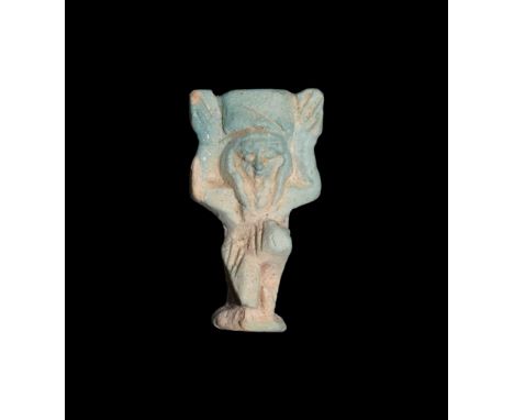 Saite Period, 624-525 BC. A pale blue glazed composition amulet of Shu kneeling with raised hands, on a D-shaped base with do
