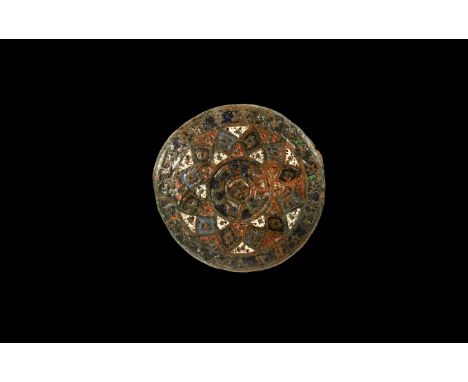 18th-19th century AD. A slightly domed disc brooch with segmented obverse, radiating cells filled with white, red and blue en