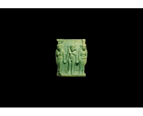 Saite Period, 624-525 BC. A pale blue glazed composition amuletic plaque with high-relief figures of Isis, Harpocrates and Ne