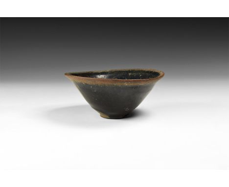 Song Dynasty, 960-1127 AD. A broad ceramic black-glazed bowl with basal ring and everted rim.  192 grams, 12.5cm (5"). From t