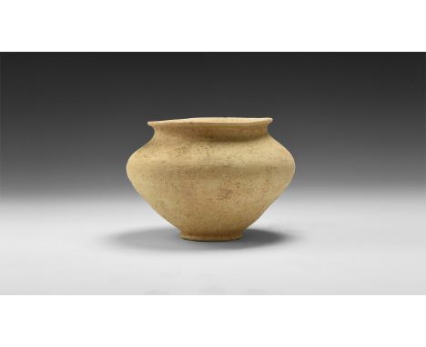 1st-3rd century AD. A small ceramic jar with broad shoulder and narrow base, everted rim.  161 grams, 12.5cm (5"). From the c