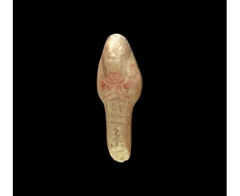 Late Period, 664-332 BC. A carved alabaster shabti with painted details including tripartite wig, seed bag, agricultural tool