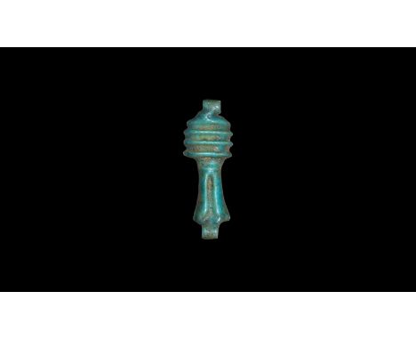New Kingdom, 1550-1070 BC. A turquoise glazed composition amulet of the djed pillar with loop to each end.  0.26 grams, 20mm 