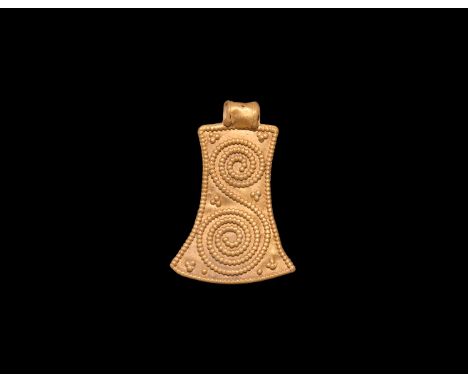 9th-11th century AD. A gold 'axe-shaped' pendant with raised pelleted border and applied coiled rope; attachment loop to the 