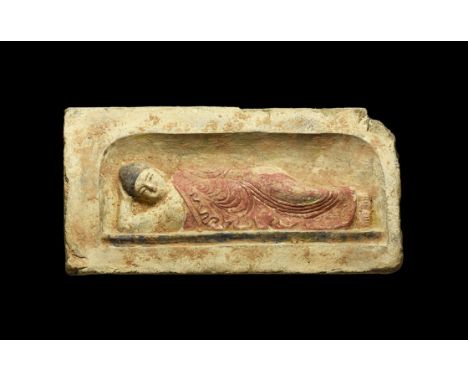 Northern Wei Dynasty, 386-535 AD. A ceramic rectangular brick with recess to the front, image of the Buddha Paranirvana, recl