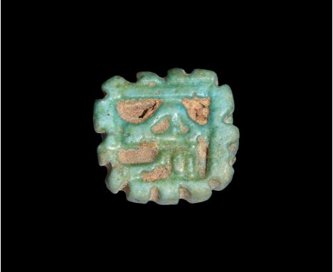 Third Intermediate Period, 1069-702 BC. A green glazed composition amulet with openwork wedjat in a frame with rilled edges. 