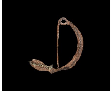 6th century BC. An iron brooch comprising a lozenge-section bow with coil and pin,bulb with two bronze chains attached, tongu