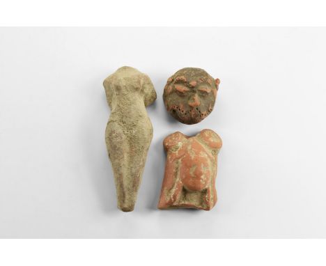 5th-3rd century BC. A mixed group of three ceramic items comprising of: a lion's head, a nude female torso, a female head wit