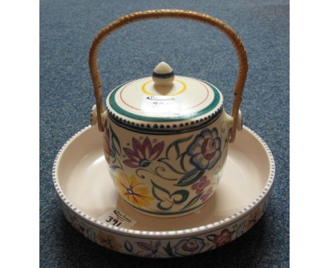 Poole Pottery lidded biscuit barrel with wicker swing handle, together with another Poole Pottery pedestal bowl. (2)(B.P. 24%