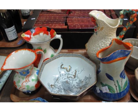 Clarice Cliff Newport Pottery 'Celtic Harvest' jug, together with three similar Art Deco floral jugs and a Wood and Sons Kore