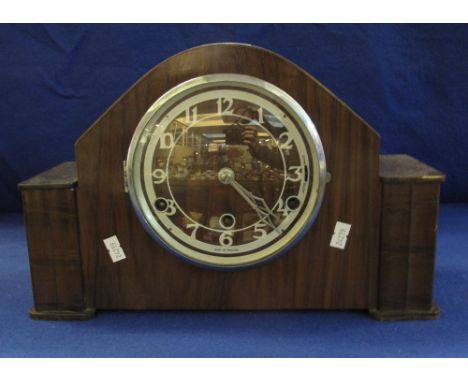 Mid Century walnut mantel clock with three train movement and Arabic face.(B.P. 24% incl. VAT)