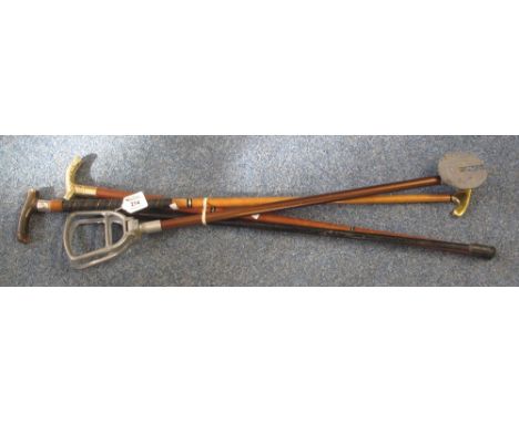 19th Century horn handled ebony walking stick with silver collar, a shooting stick, a modern brass handled walking stick and 