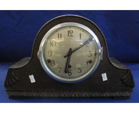 Early 20th Century oak, hat shaped, three train mantel clock with silvered Arabic face.(B.P. 24% incl. VAT)