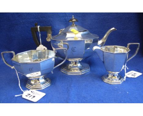 George V silver three piece, octagonal tea set, comprising: teapot; two handled sucrier and cream jug.  London, 1927, maker's