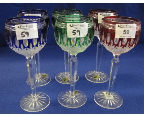 Set of six Waterford cut lead crystal coloured hock glasses with tall tapering facet stems and star cut bases, bearing labels