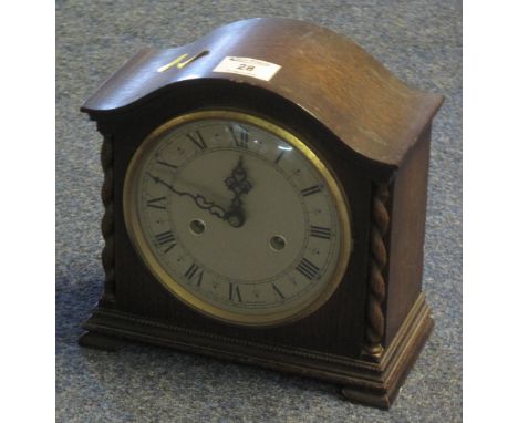 Early 20th Century oak arch topped mantel clock with silvered Roman face and two train movement.(B.P. 24% incl. VAT)