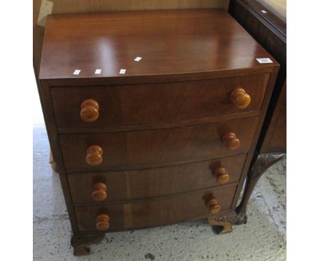 Early 20th Century small bow fronted chest of four long drawers with turned handles, on cabriole legs.(B.P. 24% incl. VAT) 