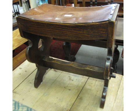 Mid 20th Century oak concave stool with leather finish and metal stud work seat.(B.P. 24% incl. VAT)