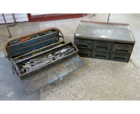 A vintage painted metal metamorphic toolbox and a table top bank of drawers 