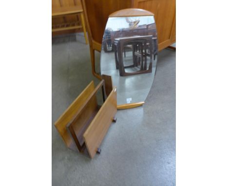 A teak framed mirror and a teak magazine rack 