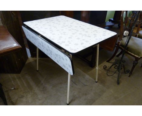 A vintage Formica topped drop-leaf kitchen table 