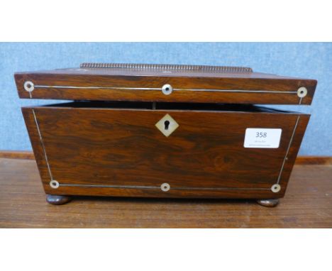 A Regency rosewood and mother of pearl inlaid tea caddy 