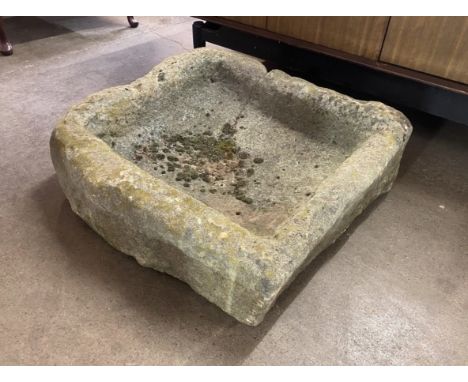 A sandstone garden trough