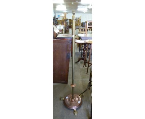 A brass and copper telescopic floor standing lamp 