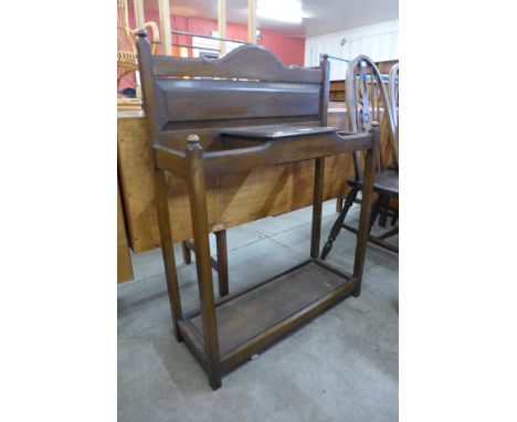 An Edward VII oak stick stand 