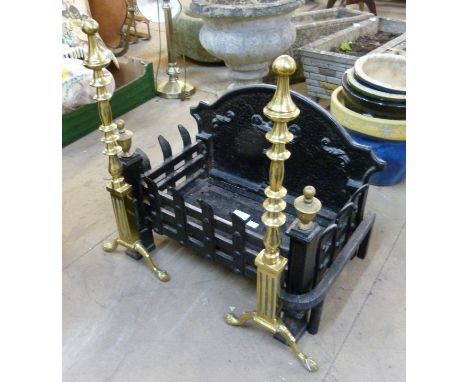 A cast iron fire grate and a pair of andirons 