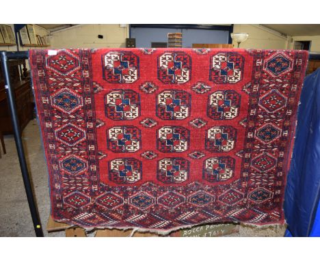 RUG WITH GEOMETRIC DESIGNS SURROUNDING A CENTRAL PANEL, APPROX 132CM X 180CM