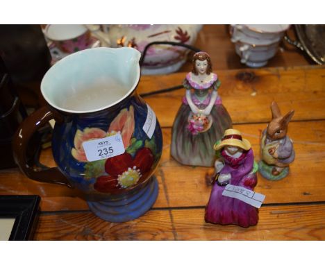 ROYAL DOULTON SERIES WARE JUG D6227 TOGETHER WITH THREE CERAMIC FIGURES