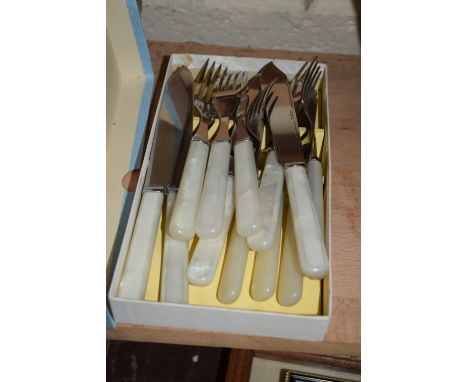 BOX CONTAINING MOTHER OF PEARL TYPE HANDLED CUTLERY