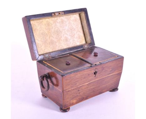 19th century Victorian walnut sarcophagus tea caddy raised on four bun feet and opening to reveal two lidded compartments wit